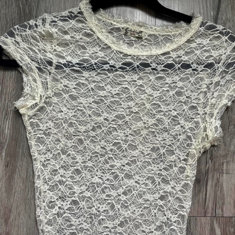 White lacy body suite by Free People